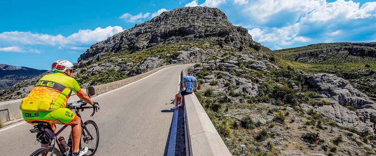 Cyclist cycling from pollensa to sa calobra in mallorca